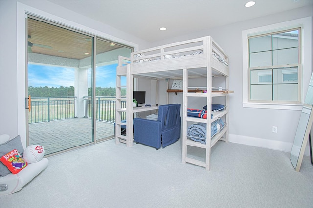 carpeted bedroom with recessed lighting, baseboards, and access to outside