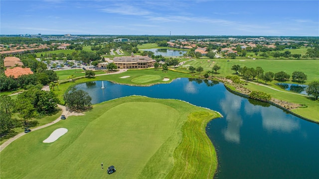 bird's eye view featuring golf course view and a water view