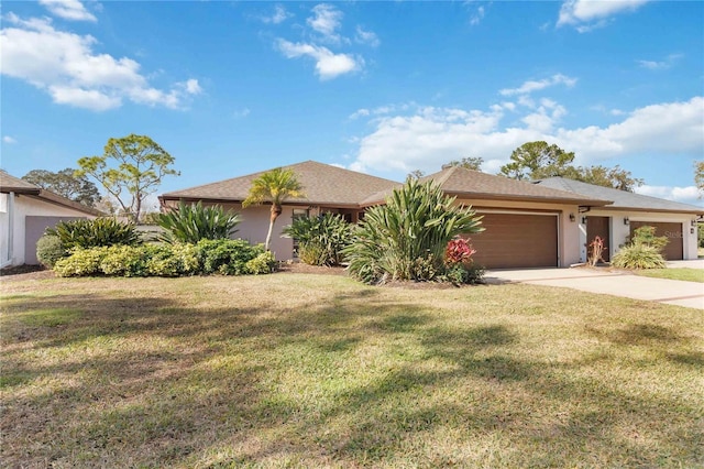 view of front facade featuring a garage and a front yard