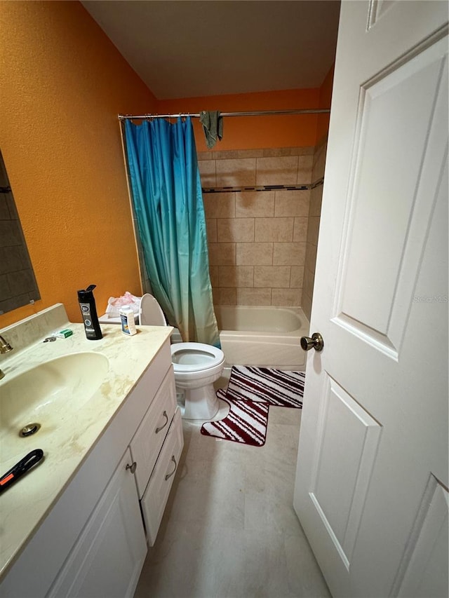 full bathroom with shower / bath combo, vanity, and toilet