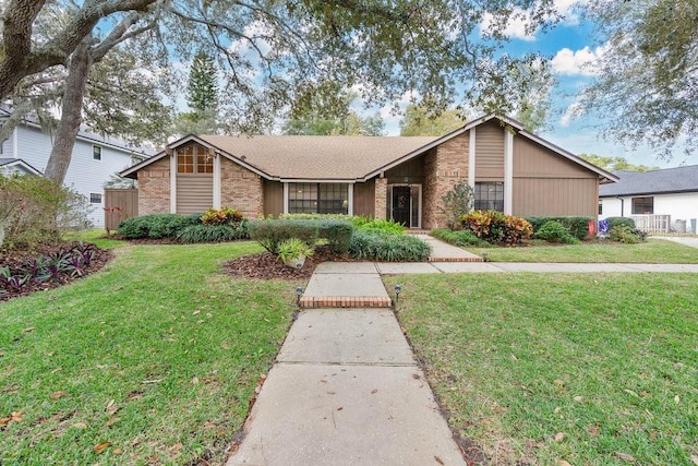 ranch-style home with a front lawn