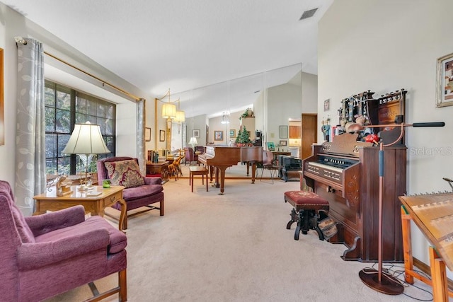 living area featuring carpet flooring and lofted ceiling