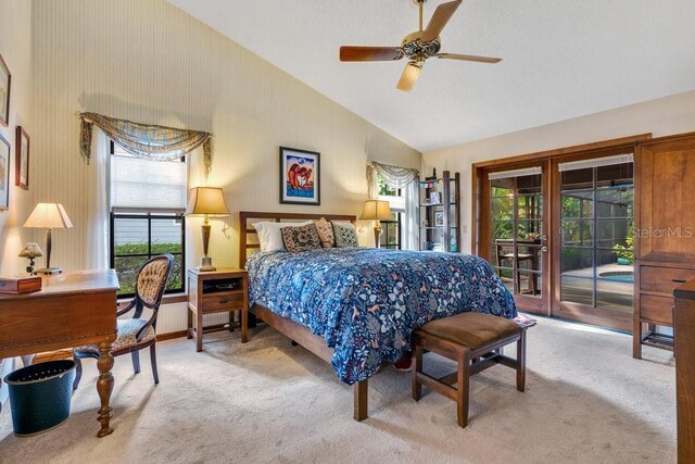 bedroom featuring access to exterior, light carpet, vaulted ceiling, and ceiling fan