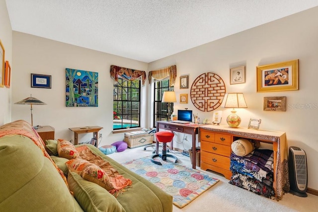 carpeted home office with a textured ceiling