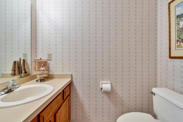 bathroom with vanity and toilet