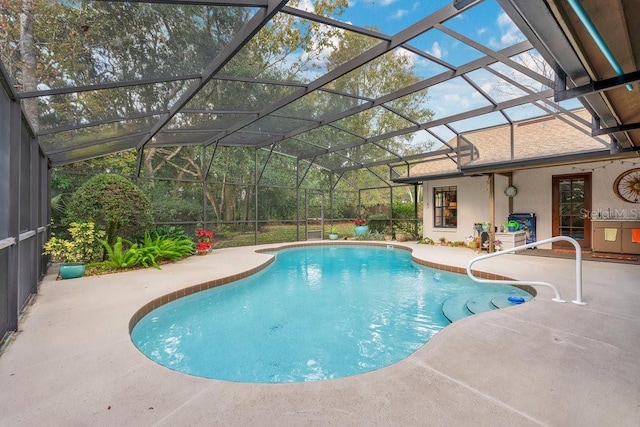 view of pool with a lanai and a patio area