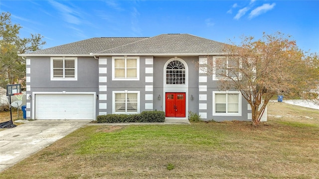 view of front of property with a front yard and a garage