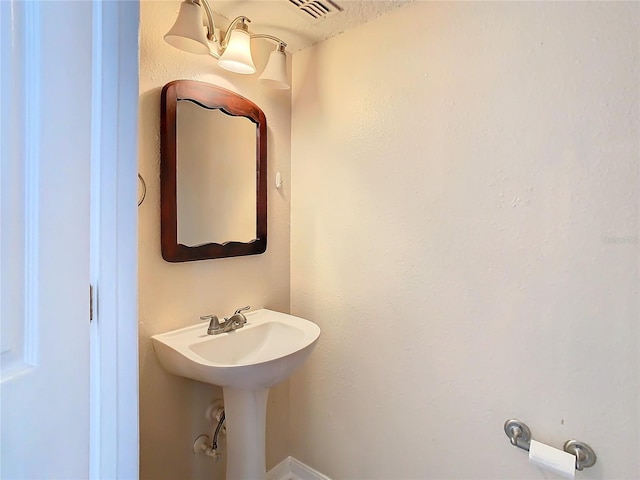 bathroom featuring a textured ceiling