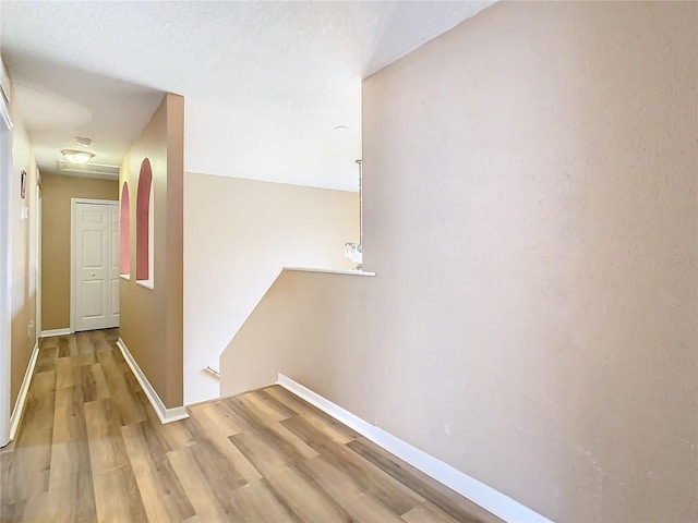 corridor featuring light hardwood / wood-style floors