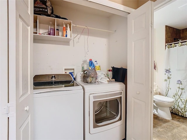 laundry area featuring washing machine and clothes dryer