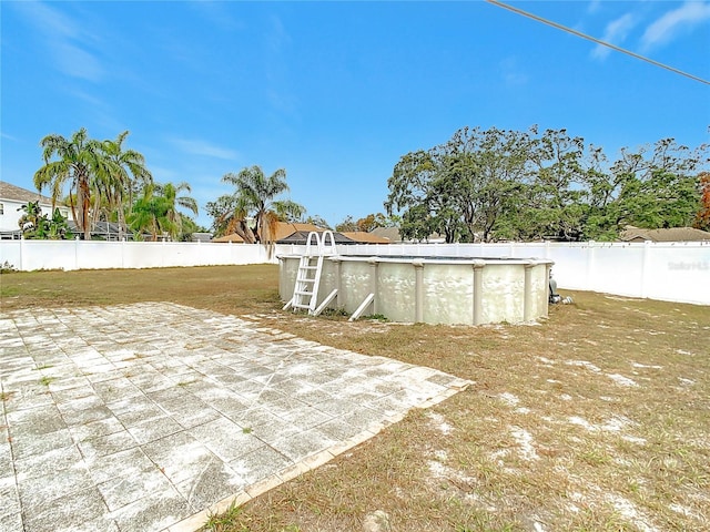 view of patio featuring a fenced in pool