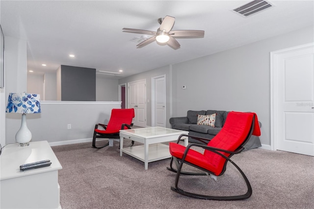 living room featuring ceiling fan and carpet