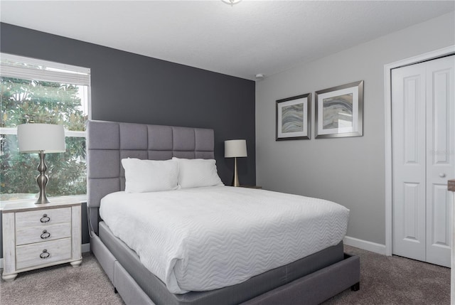 carpeted bedroom featuring a closet