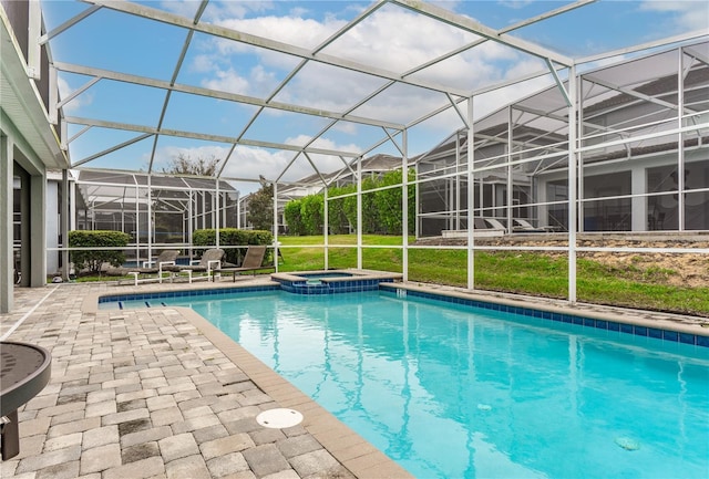 view of swimming pool featuring glass enclosure and a patio