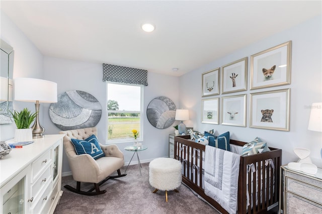 bedroom with carpet and a nursery area