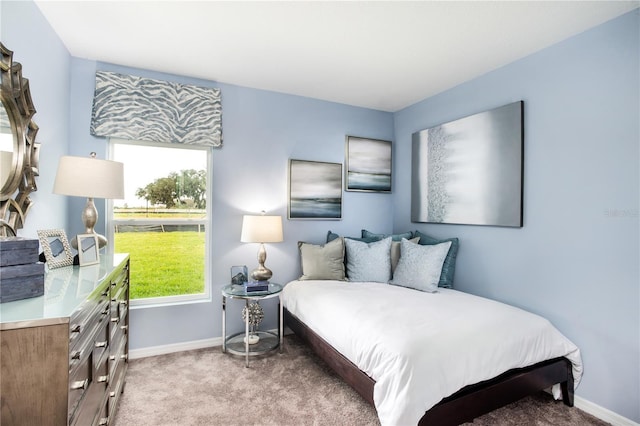 bedroom featuring light carpet