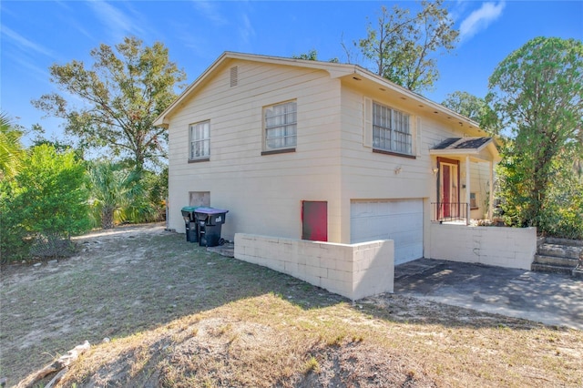 view of side of home with a garage