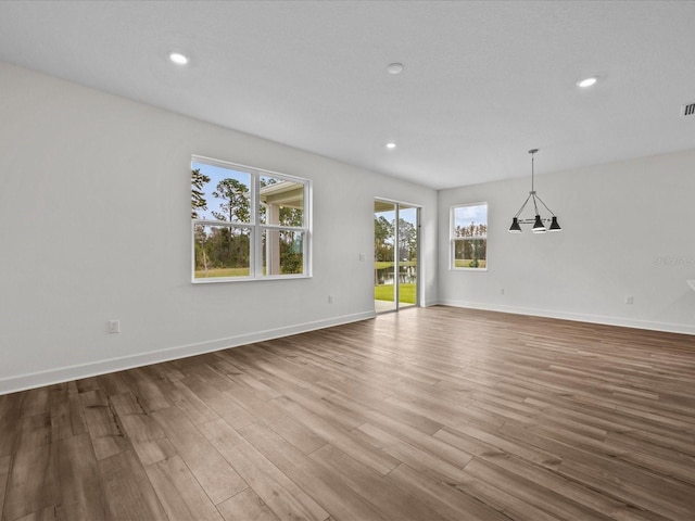 empty room with light hardwood / wood-style floors