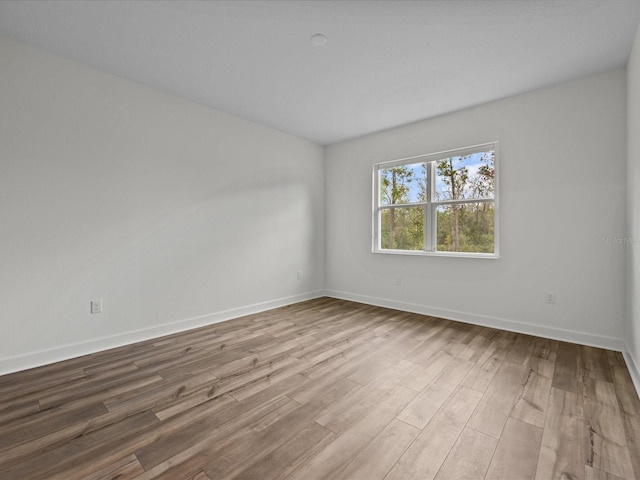 spare room featuring light wood-type flooring