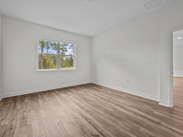 empty room with light hardwood / wood-style floors