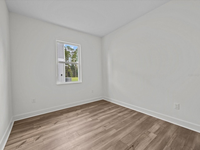 unfurnished room with light hardwood / wood-style floors