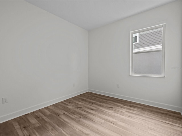 spare room with light wood-type flooring