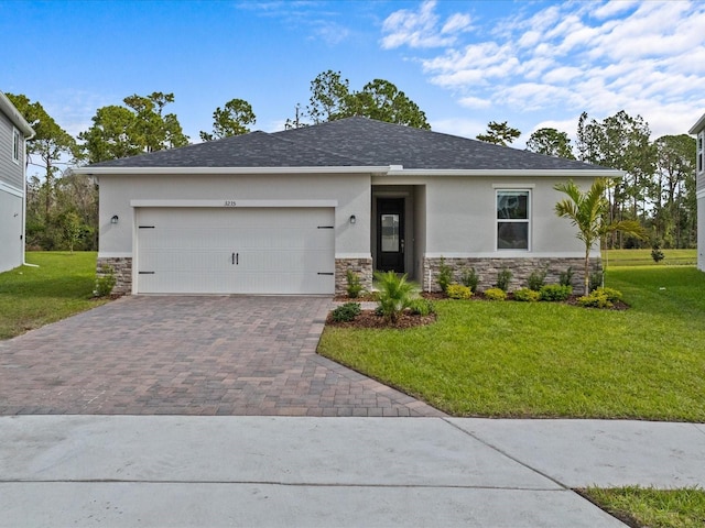 view of front of property featuring a garage and a front yard