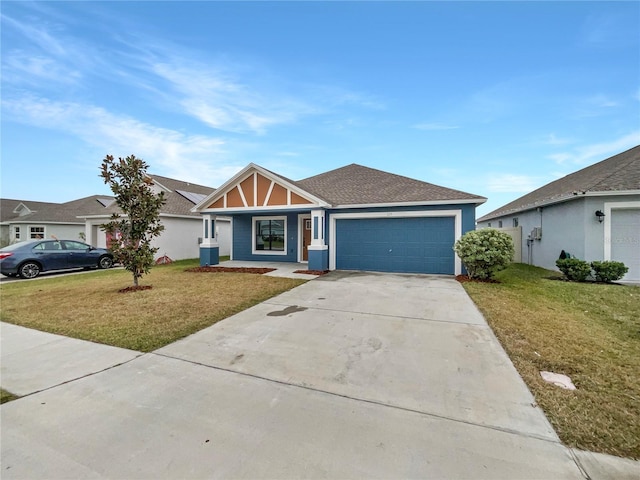 ranch-style home with covered porch, a garage, and a front lawn