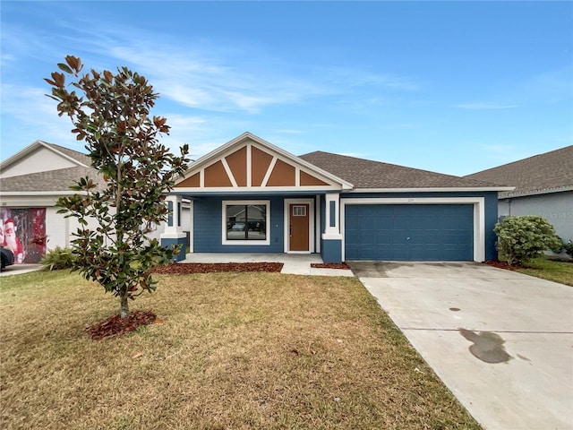 view of front of property featuring a porch, a garage, and a front lawn