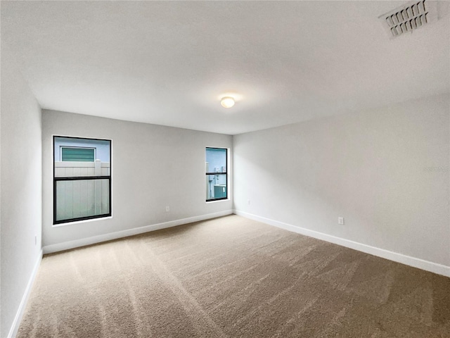 empty room featuring carpet flooring