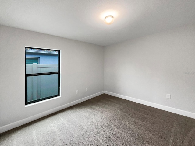 unfurnished room with carpet flooring