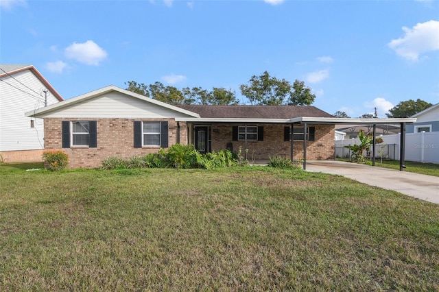 single story home with a front lawn and a carport