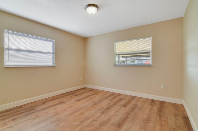 unfurnished room featuring light wood-type flooring