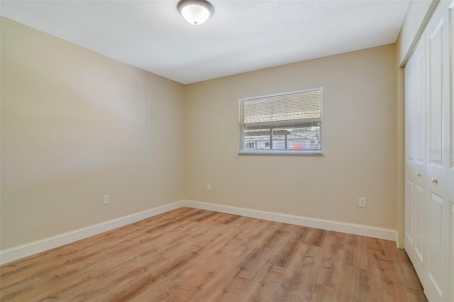 unfurnished room featuring light hardwood / wood-style floors