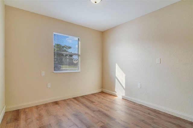 unfurnished room featuring light hardwood / wood-style flooring