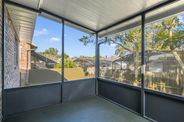 unfurnished sunroom featuring plenty of natural light