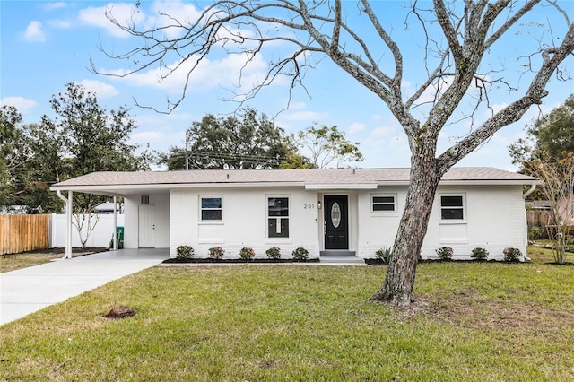 ranch-style home featuring a front yard and a carport