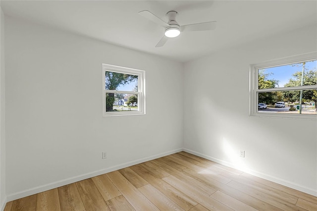 unfurnished room featuring light wood-type flooring and ceiling fan