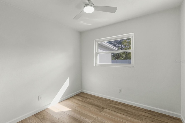 empty room with light hardwood / wood-style floors and ceiling fan