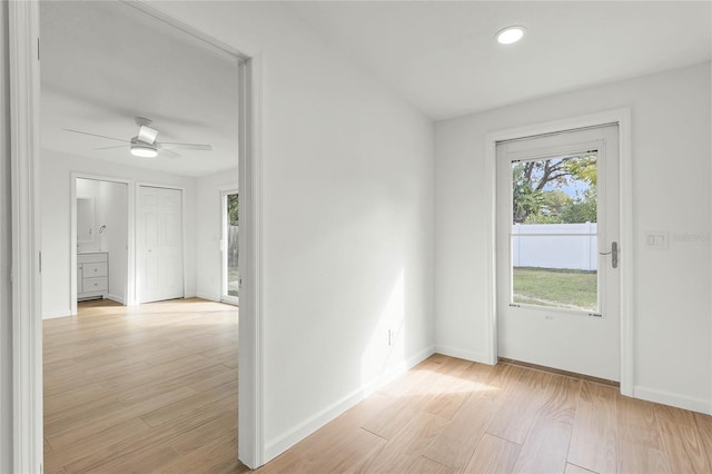 interior space with light wood-type flooring and ceiling fan