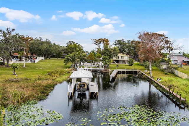 view of dock featuring a water view and a lawn