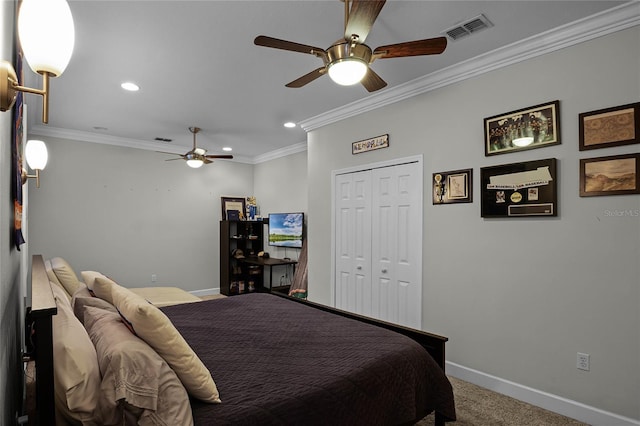 carpeted bedroom featuring a closet, ceiling fan, and crown molding