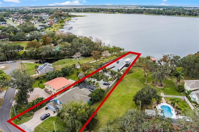 birds eye view of property with a water view