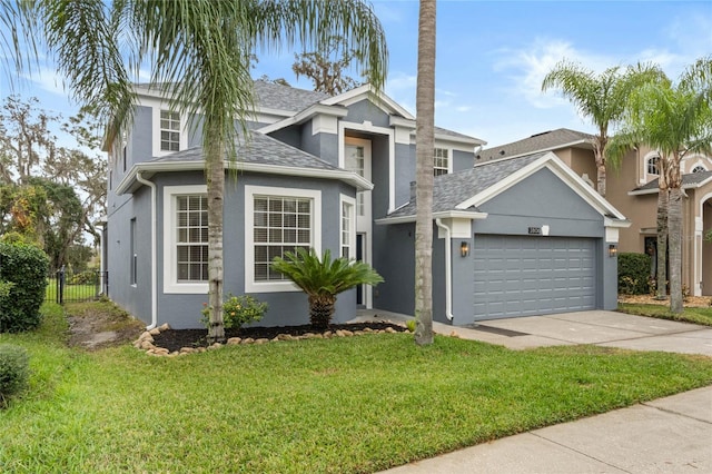 view of front property with a garage and a front yard