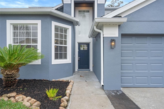 2806 Balforn Tower Way, Winter Garden, FL 34787 - doorway to property with an attached garage and stucco siding