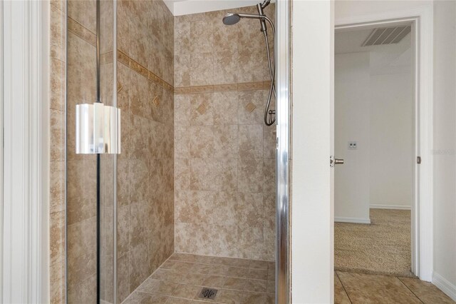 bathroom featuring tile patterned floors and walk in shower