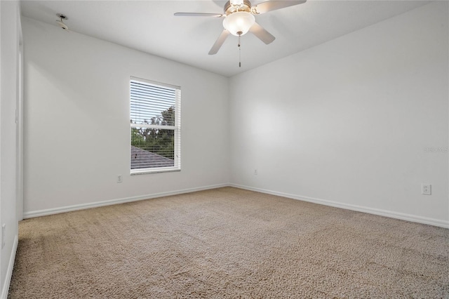 carpeted empty room with ceiling fan