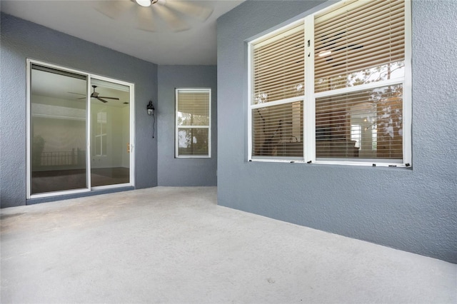 view of patio featuring ceiling fan