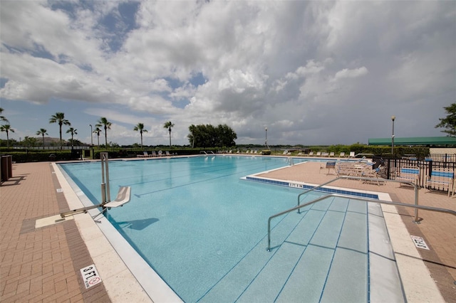 view of swimming pool with a patio area