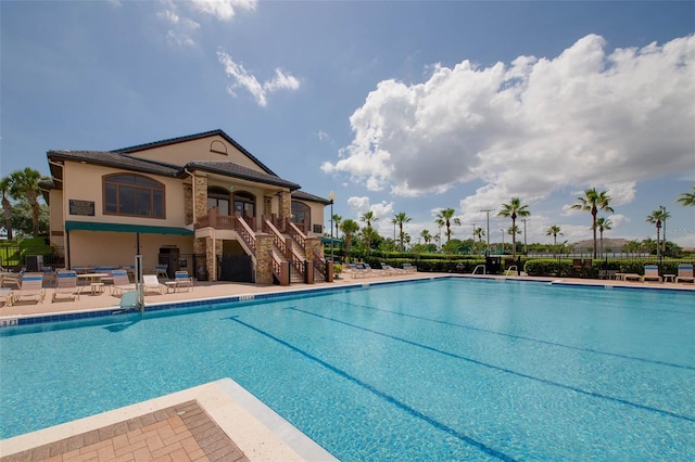 view of swimming pool featuring a patio area